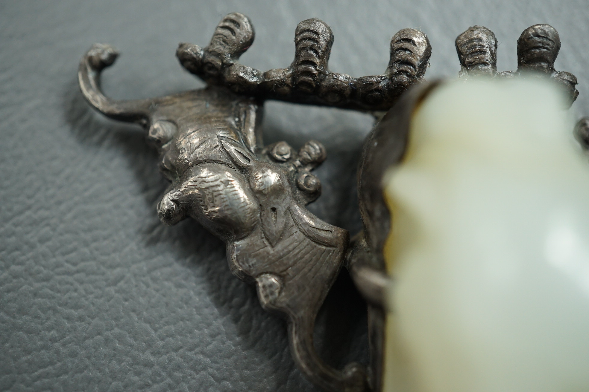 A Chinese jade and cabochon mounted hand mirror, the jade 18th/19th century
